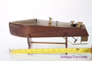 Mahogany windup toy boat from America with brass