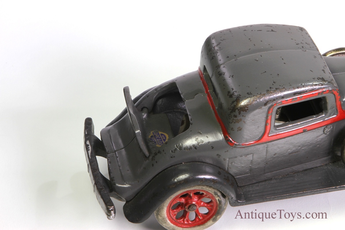 Arcade REO Rumble Seat Coupe Cast Iron Toy Car and Driver, With Side Mount  Spare Tires 
