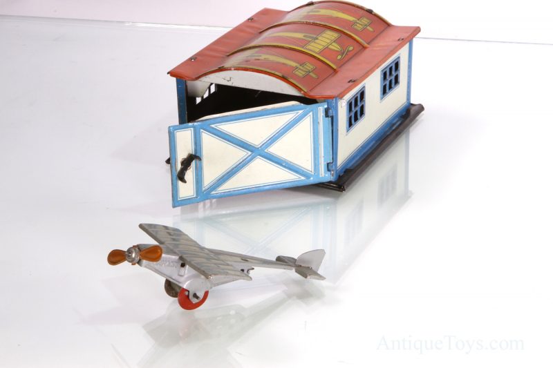 German Tin Lithographed Airplane Penny Toy with Hangar <FONT COLOR="ff000 ">*SOLD*</font>