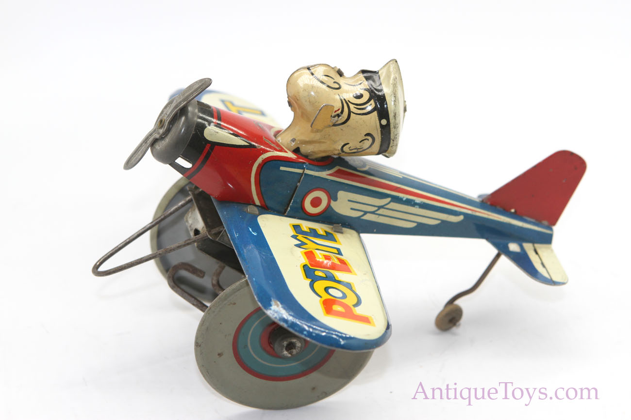 Wind up airplane toy top