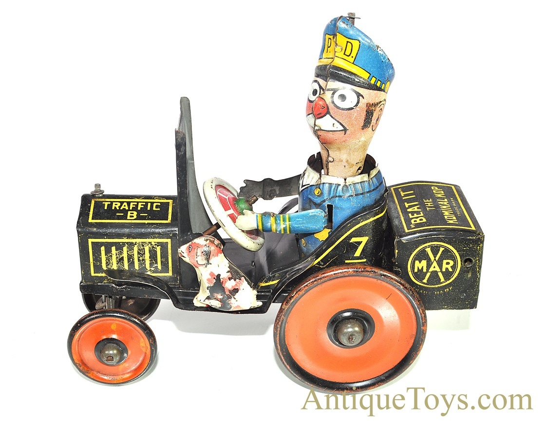 Louis Marx and Company - Komikal Kop Tin Wind-Up Toy by Louis Marx Co.,  circa 1930