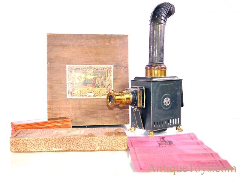 Ernst Plank “Lanterna Magica” #1518 Gloria Nr. German Tin Oil Lamp Magic Lantern Projector with 12 Slides & Wooden Box, Plus Extra Box of 11”x 3.5” Glass Slides <FONT COLOR="ff000 ">*SOLD*</font>