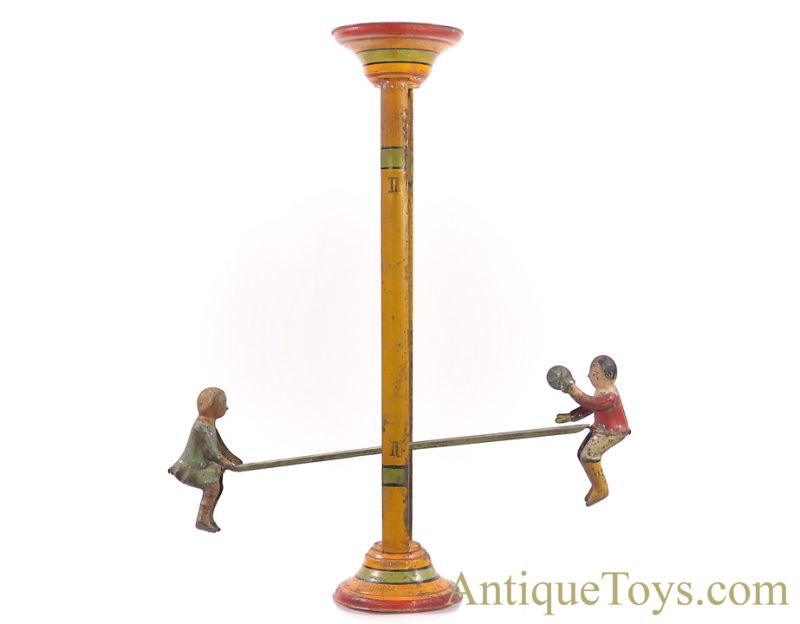Gibbs Mfg. Co. Flip Over Tin Hand Painted Boy & Girl on Teeter Totter Toy