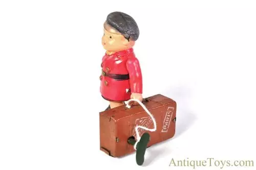 Alps Shoji ca. 1945-1952 Occupied Japan Celluloid Tin Litho Windup "Travelling Boy" with Suitcase for Sale